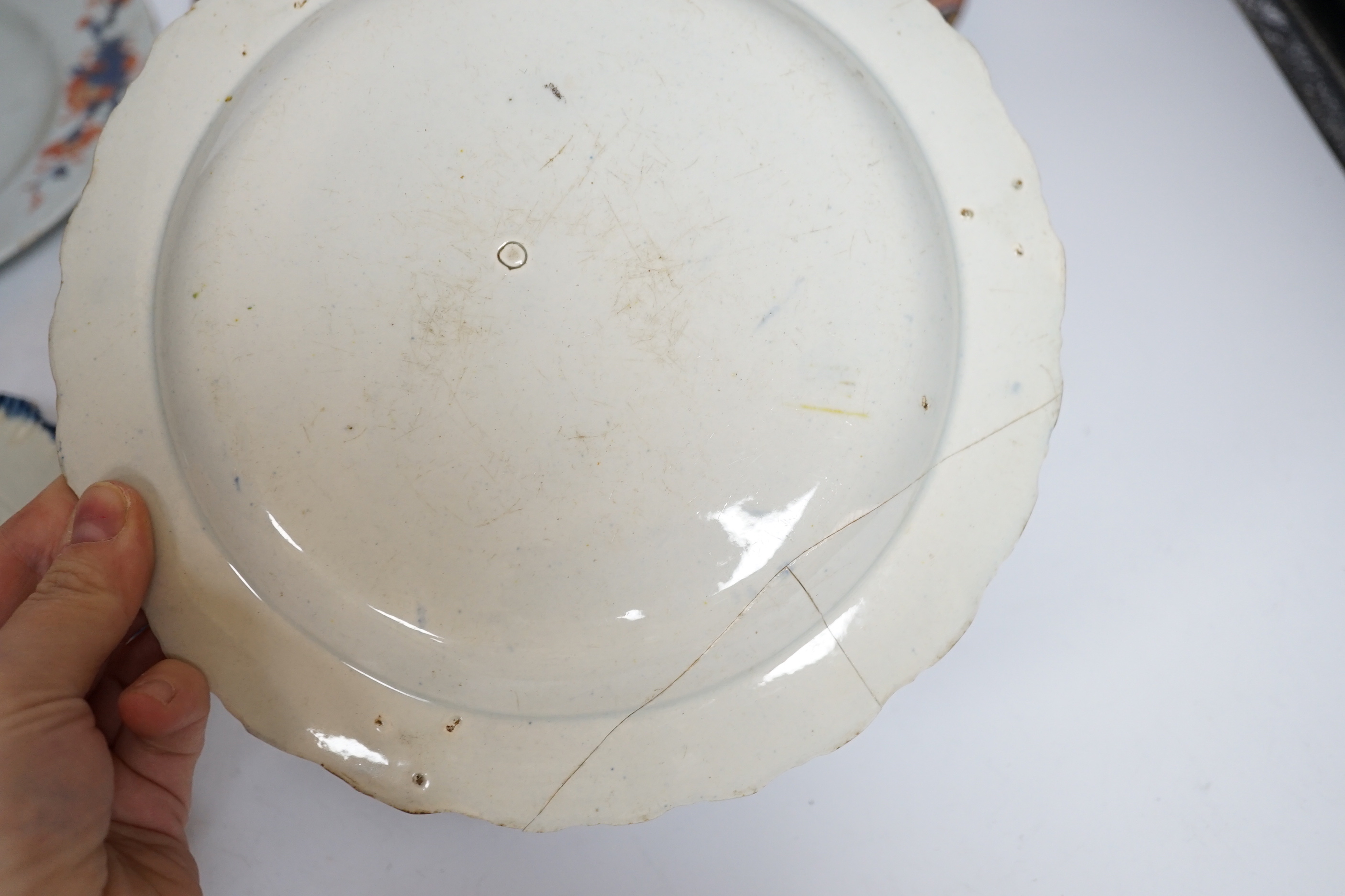 Two late 18th century pearlware Prattware plates, a Chinese export plate and an ironstone plate, largest 27cm in diameter